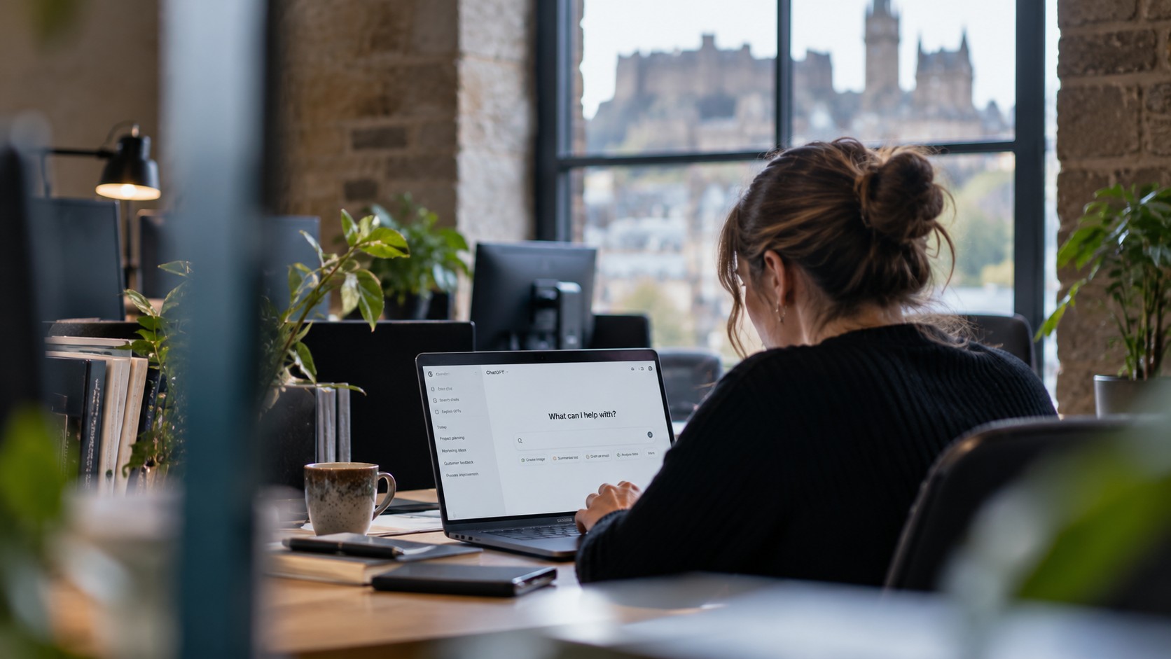 Woman in Edinburgh working at aher laptop